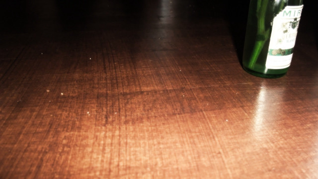 Wine bottle wooden table blurry free wallpaper for desktop - medium preview image