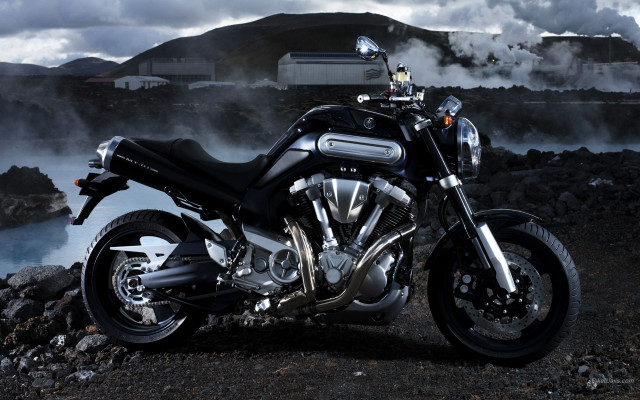 Motorcycle parked rocky road water free wallpaper for desktop - medium preview image