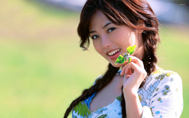 Woman holding leaf smiling green #2 free wallpaper for desktop - medium preview image