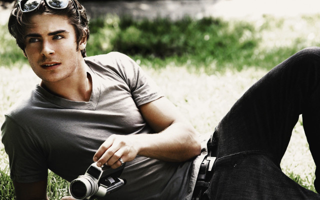 Man sitting grass camera other free wallpaper for desktop - medium preview image