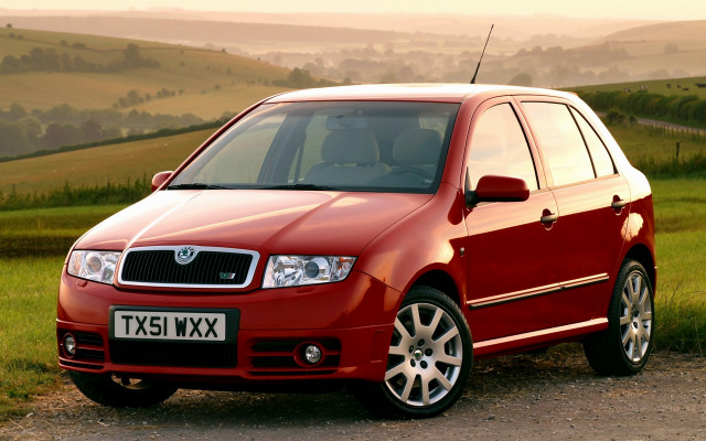 Red car dirt road grass free wallpaper for desktop - medium preview image
