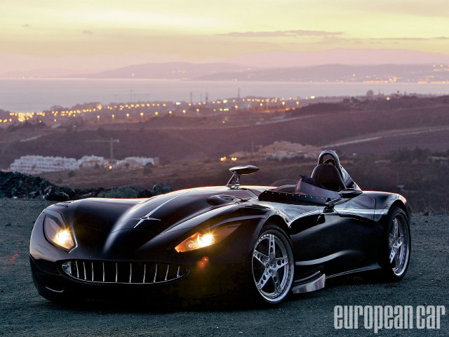 Black sports car hill city free wallpaper for desktop - medium preview image