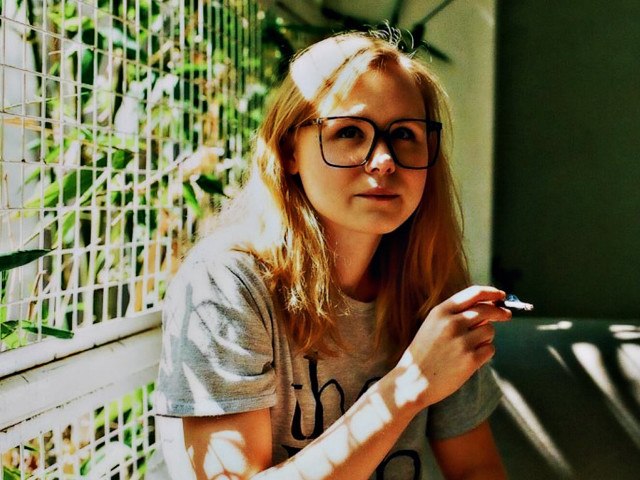 Woman glasses bench smoking cigarette free wallpaper for desktop - medium preview image