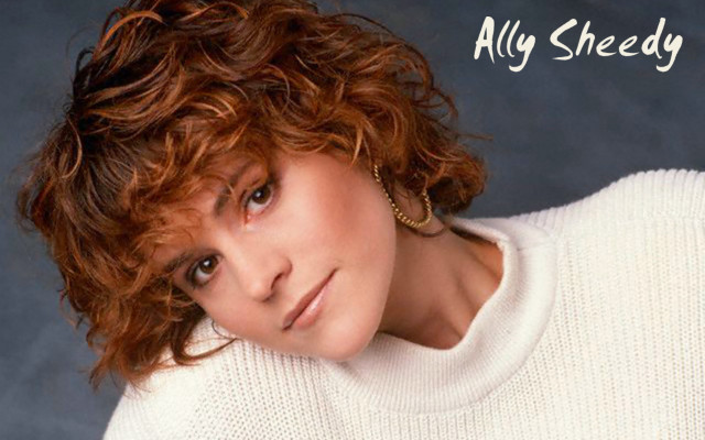 Woman curly hair white sweater free wallpaper for desktop - medium preview image