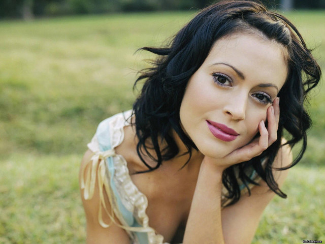 Woman laying hand face cheek free wallpaper for desktop - medium preview image