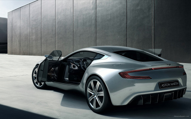 Silver sports car parked building free wallpaper for desktop - medium preview image