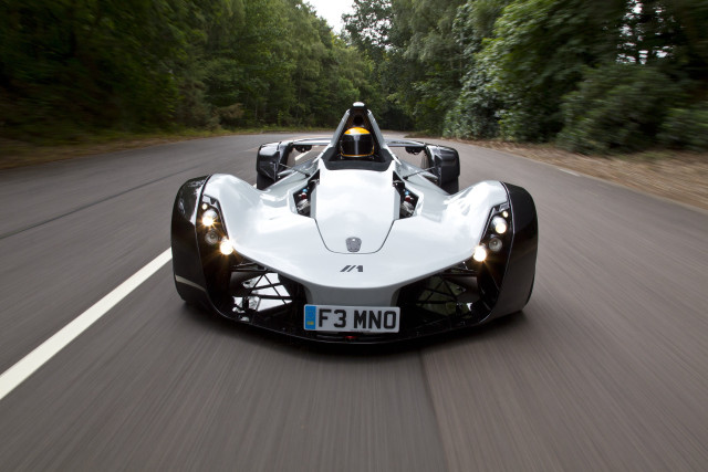 White racecar driving forest road free wallpaper for desktop - medium preview image