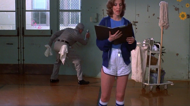 Woman shorts blue shirt book free wallpaper for desktop - medium preview image