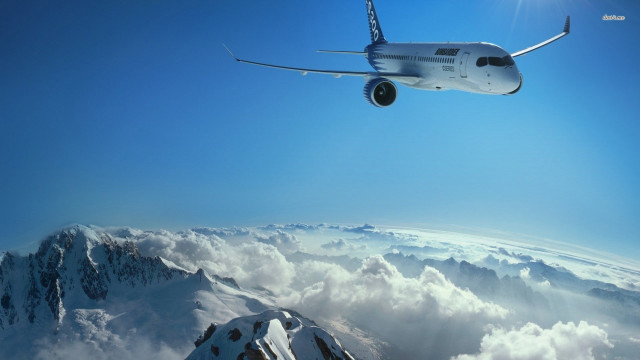 Plane flying mountain range clouds free wallpaper for desktop - medium preview image