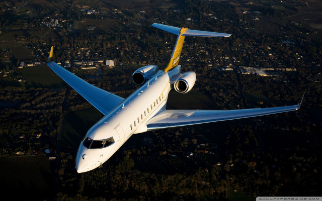 White yellow airplane flying city free wallpaper for desktop - medium preview image