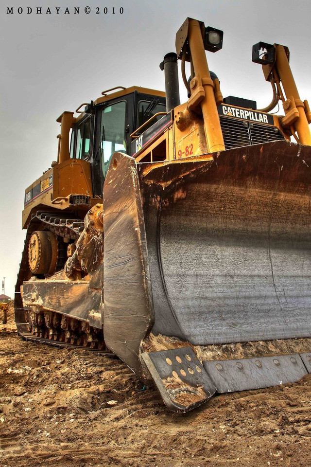 Bulldozer parked dirt field sky free wallpaper for mobile - medium preview image
