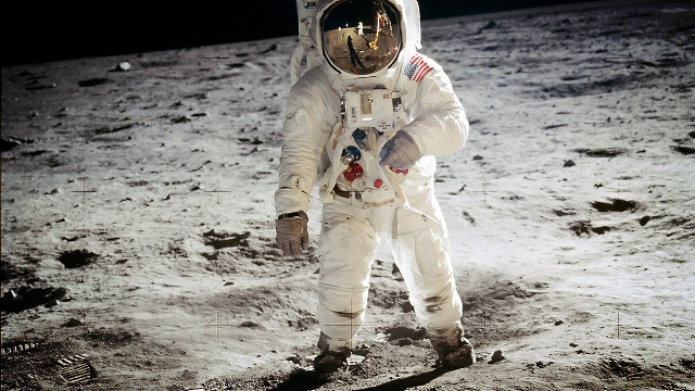 Astronaut walking moon helmet space free wallpaper for desktop - medium preview image