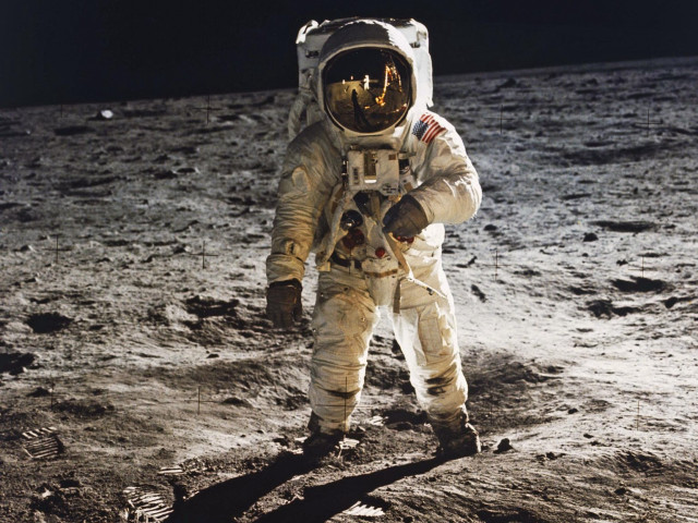 Astronaut walking moon helmet hand free wallpaper for desktop - medium preview image