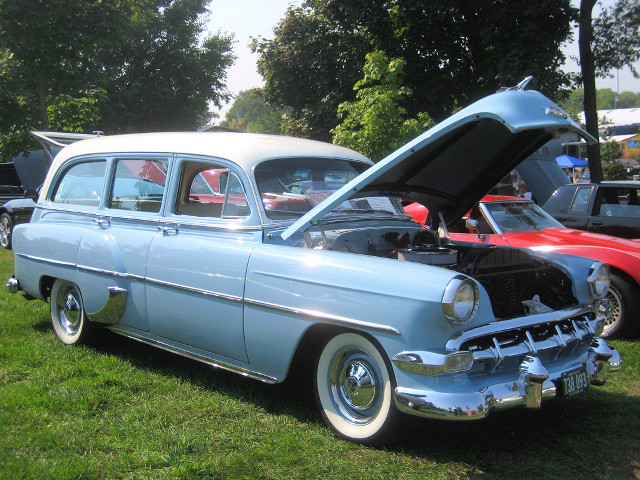 Blue car hood open grass free wallpaper for desktop - medium preview image