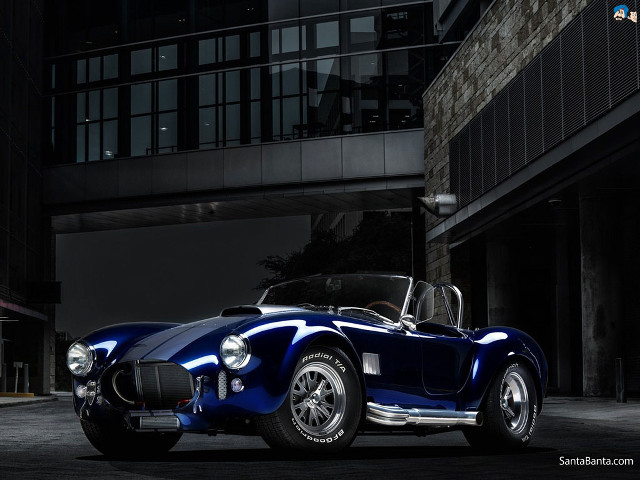 Blue sports car night building free wallpaper for desktop - medium preview image