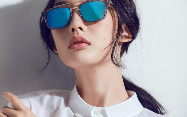 Woman sunglasses white shirt pointing free wallpaper for desktop - medium preview image