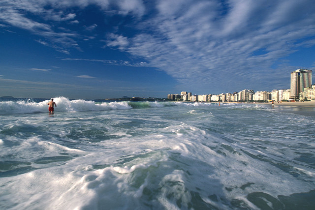 Person ocean city waves sunny free wallpaper for desktop - medium preview image