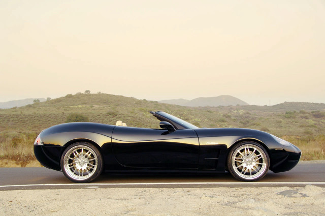 Black sports car hill mountain free wallpaper for desktop - medium preview image