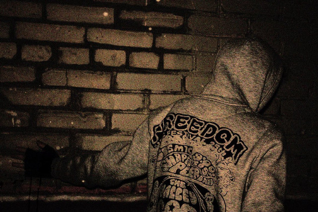 Hoodie person brick wall fire free wallpaper for desktop - medium preview image