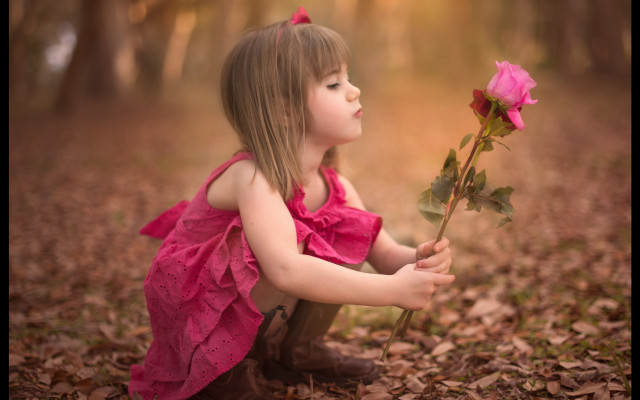 Little girl pink dress holding free wallpaper for desktop - medium preview image