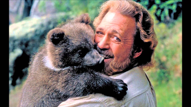 Man holding monkey smiling camera free wallpaper for desktop - medium preview image