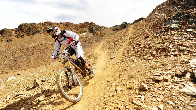 Man riding bike dirt road #2 free wallpaper for desktop - medium preview image