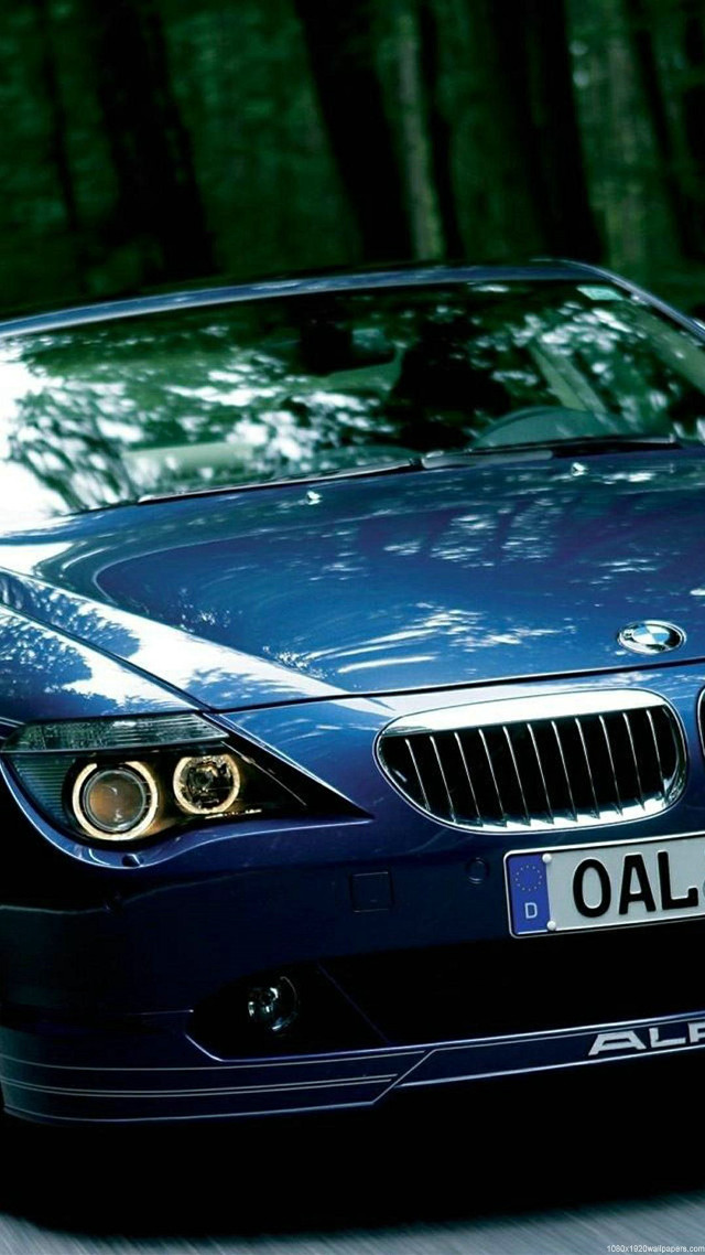 Blue car driving street forest free wallpaper for mobile - medium preview image