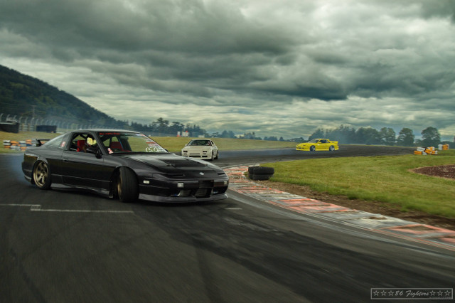 Two cars driving track cloudy free wallpaper for desktop - medium preview image