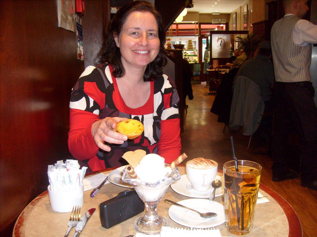 Woman sitting table food drinks free wallpaper for desktop - medium preview image