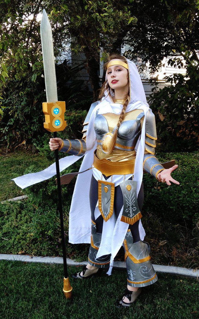 Woman costume sword stick posing free wallpaper for mobile - medium preview image