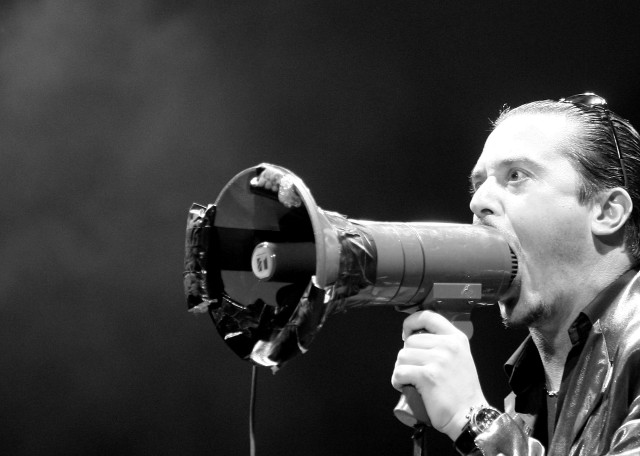Man holding megaphone singing microphone free wallpaper for desktop - medium preview image