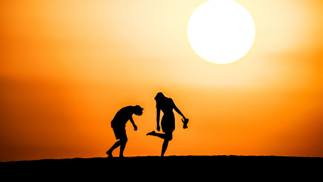 Couple people dirt sunset sky free wallpaper for desktop - medium preview image
