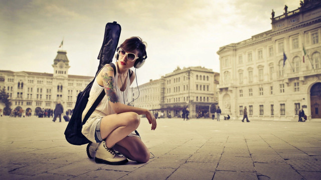 Woman kneeling guitar case backpack free wallpaper for desktop - medium preview image