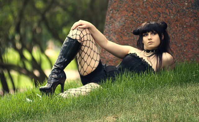 Woman black dress boots sitting free wallpaper for desktop - medium preview image