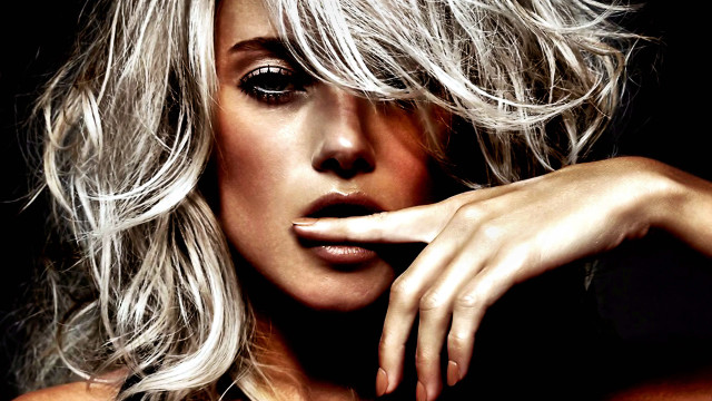 Blonde woman black background hand free wallpaper for desktop - medium preview image