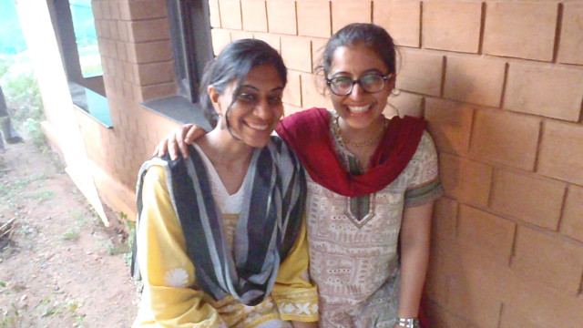 Two women bench brick wall free wallpaper for desktop - medium preview image