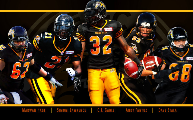Football players group holding ball free wallpaper for desktop - medium preview image