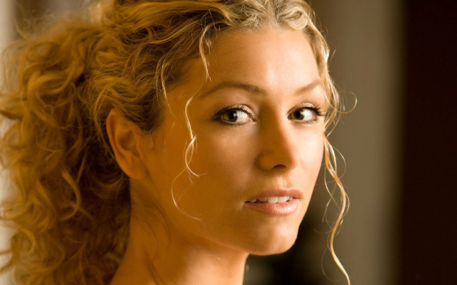 Blonde woman serious blue eyes free wallpaper for desktop - medium preview image