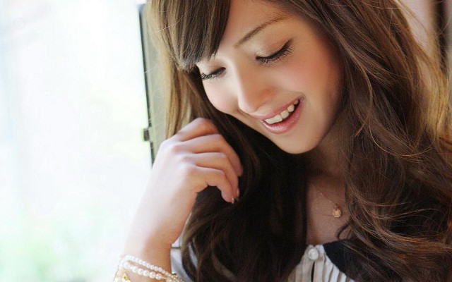 Woman long hair bracelet smiling free wallpaper for desktop - medium preview image