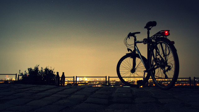 Bicycle parked brick walkway night free wallpaper for desktop - medium preview image
