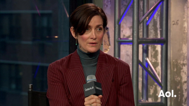 Woman red jacket turtleneck microphone free wallpaper for desktop - medium preview image