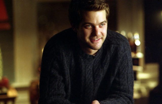 Man sitting remote smile happy free wallpaper for desktop - medium preview image