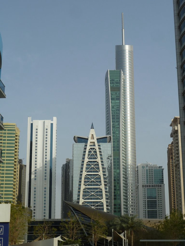 City clocktower blue sky modernism free wallpaper for mobile - medium preview image