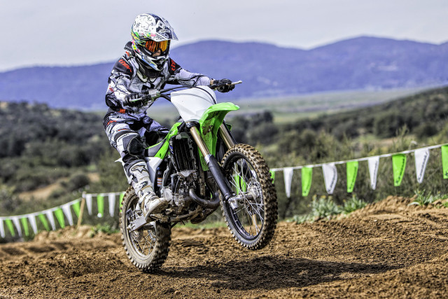 Man riding dirt bike mountains free wallpaper for desktop - medium preview image
