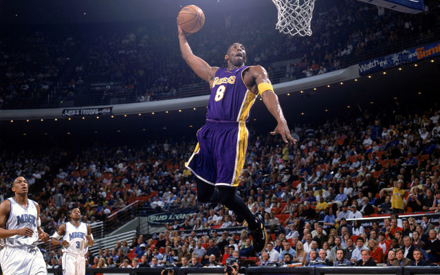 Man purple uniform dunking basketball #2 free wallpaper for desktop - medium preview image