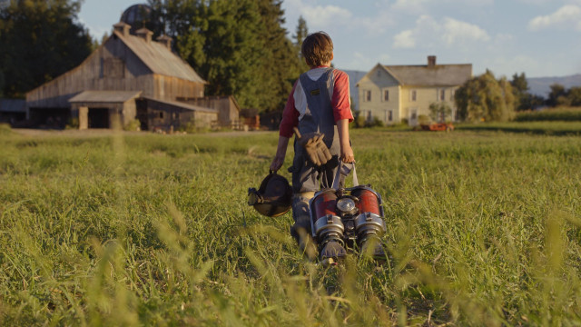 Person walking backpack field grass free wallpaper for desktop - medium preview image