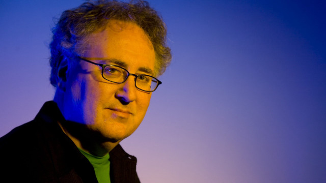 Man glasses green shirt serious free wallpaper for desktop - medium preview image