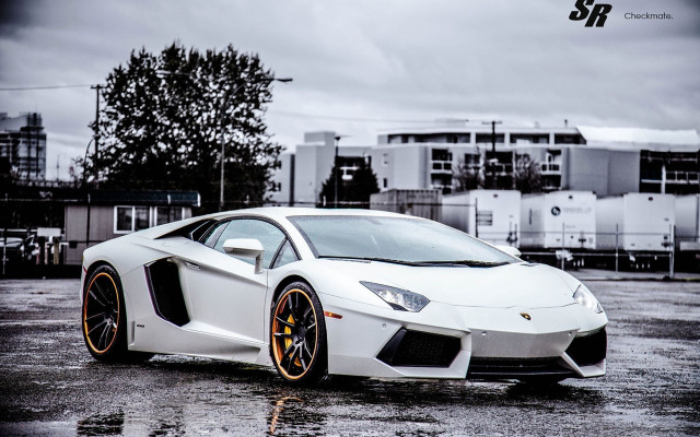 White orange sportscar parkinglot cloudy free wallpaper for desktop - medium preview image