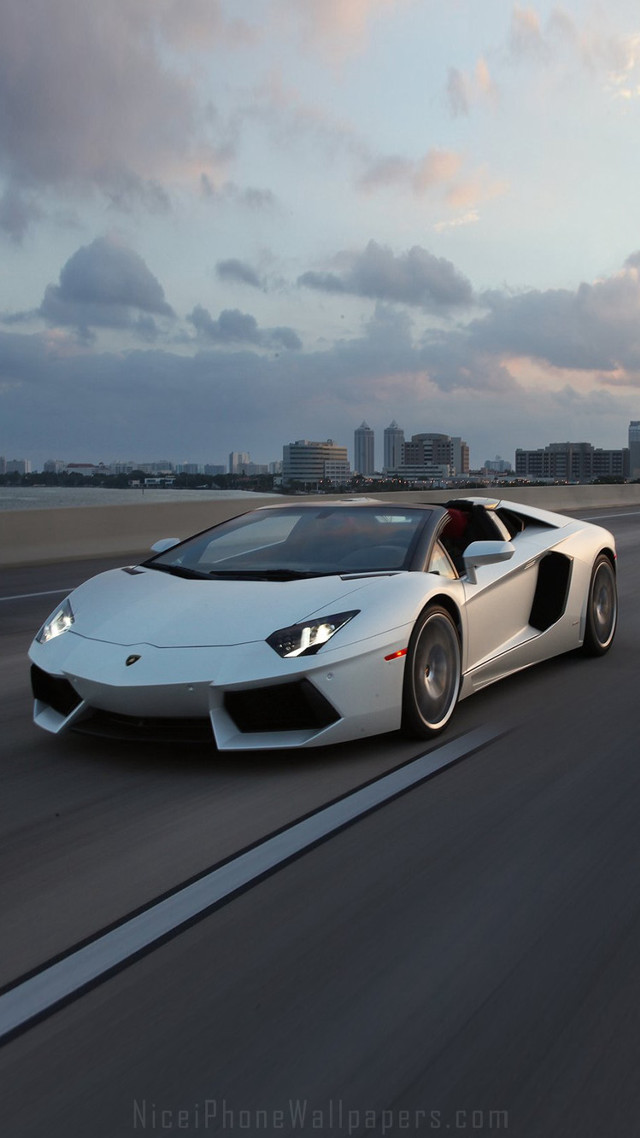 White sports car highway city free wallpaper for mobile - medium preview image