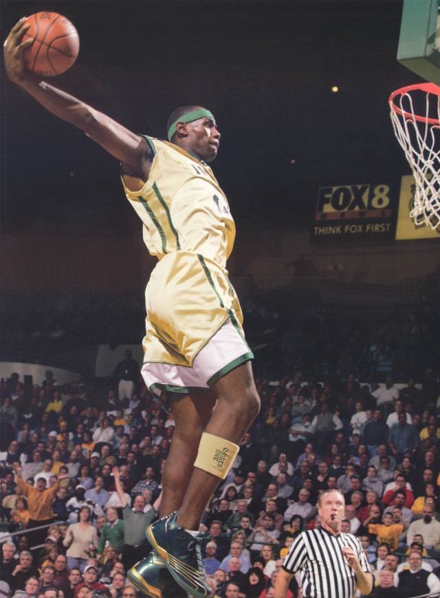 Man yellow uniform dunking basketball free wallpaper for mobile - medium preview image